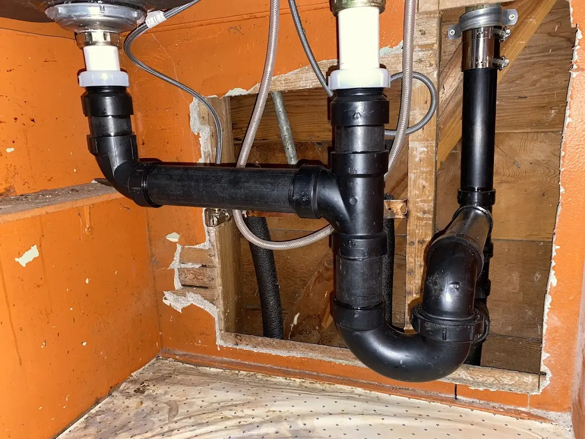Professional Garbage Disposal Repair equipment and tools on the job in Chesapeake